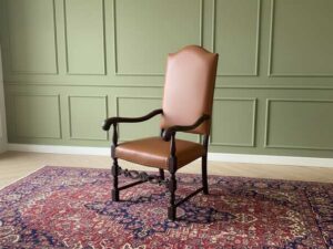 Armchair covered in brown leather, European made from Germany.