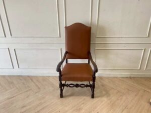 Armchair covered in brown leather, European made from Germany.