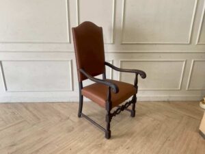 Armchair covered in brown leather, European made from Germany.