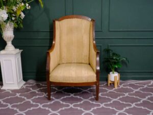 Armchair, wooden frame, fabric cushion, cream color.