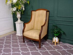 Armchair, wooden frame, fabric cushion, cream color.