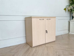 Cabinet for storing documents or items, two-door cabinet, light brown wooden frame.