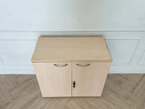 Cabinet for storing documents or items, two-door cabinet, light brown wooden frame.