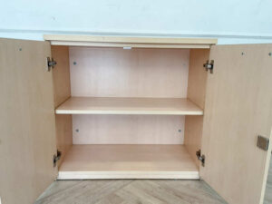Cabinet for storing documents or items, two-door cabinet, light brown wooden frame.
