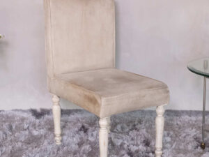 Wooden chair, beige fabric cushion, beautiful design on the legs.