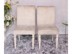 Wooden chair, beige fabric cushion, beautiful design on the legs.