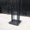 Product shelves, 2 sides, glass divider in the middle Black steel frame, wooden base