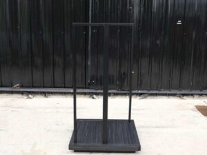 Product shelves, 2 sides, glass divider in the middle Black steel frame, wooden base
