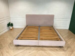 Bed 6 feet, covered with cream-colored fabric. **Only the bed, mattress already sold**