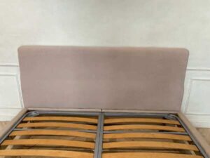 Bed 6 feet, covered with cream-colored fabric. **Only the bed, mattress already sold**