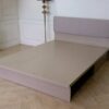 5 foot bed, wooden frame, fabric cushioned headboard, gray color.
