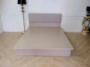 5 foot bed, wooden frame, fabric cushioned headboard, gray color.