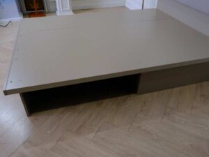 5 foot bed, wooden frame, fabric cushioned headboard, gray color.