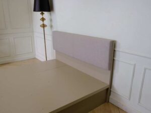 5 foot bed, wooden frame, fabric cushioned headboard, gray color.