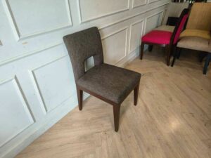 Wooden chair, dark gray fabric cushion, beautiful frame, cushioned backrest.