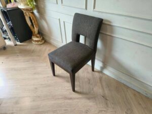 Wooden chair, dark gray fabric cushion, beautiful frame, cushioned backrest.
