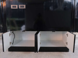 3-tiered product shelves, black high-gloss surface There are 2 storage cabinets in the back that open.
