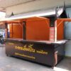 A stall selling goods, a snack stall, made of steel with wheels, designed in Thai style, equipped with water system and electricity system.