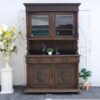 Tall buffet cabinet, carved leaf pattern. European work comes from Germany.
