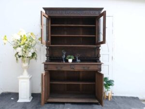 Tall buffet cabinet, carved leaf pattern. European work comes from Germany.