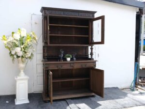 Tall buffet cabinet, carved leaf pattern. European work comes from Germany.