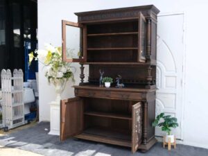 Tall buffet cabinet, carved leaf pattern. European work comes from Germany.