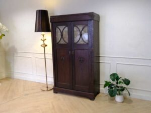 Wardrobe with 2 doors, vintage style, walnut wood color, European workmanship, sourced from Germany.