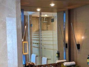 Mirror in the bathroom with lights built in on 2 sides.