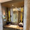 Mirror in the bathroom with lights built in on 2 sides.