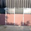 Partition, steel frame, glass top, brown color.