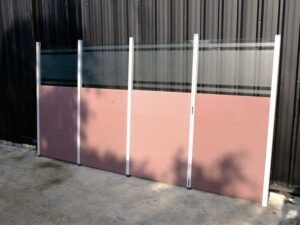 Partition, steel frame, glass top, brown color.