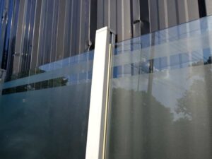 Partition, steel frame, glass top, brown color.