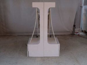 watch display shelf Hanging product display shelf, white wooden frame, with 2 storage drawers.