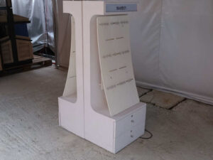 watch display shelf Hanging product display shelf, white wooden frame, with 2 storage drawers.
