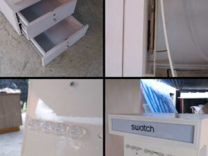 watch display shelf Hanging product display shelf, white wooden frame, with 2 storage drawers.