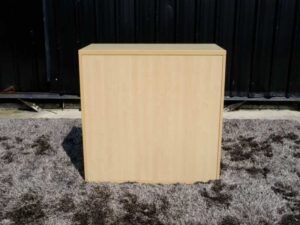 Document cabinet, 2 doors, open, wooden top, plain cream color.