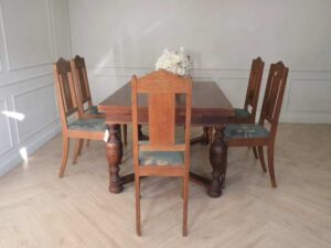 Extendable table set with 6 chairs, blue fabric cushions, European craftsmanship, sourced from Germany.