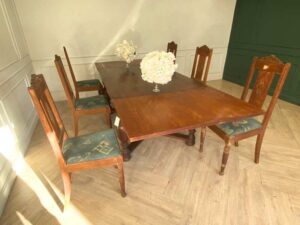 Extendable table set with 6 chairs, blue fabric cushions, European craftsmanship, sourced from Germany.