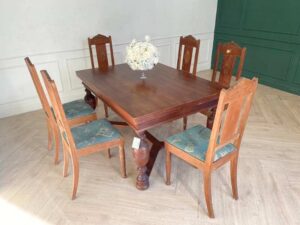 Extendable table set with 6 chairs, blue fabric cushions, European craftsmanship, sourced from Germany.