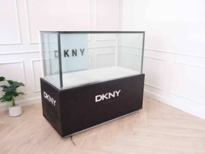 Jewelry cabinet, glass cabinet to display products Rectangular shape, 2 sliding glass doors, black base, has 2 sliding doors for storage.