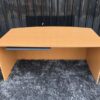 Executive desk With keyboard rail, wooden frame, cream color.