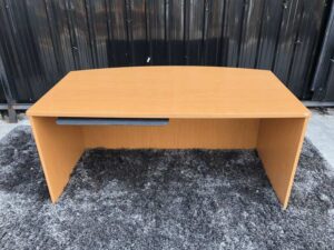 Executive desk With keyboard rail, wooden frame, cream color.