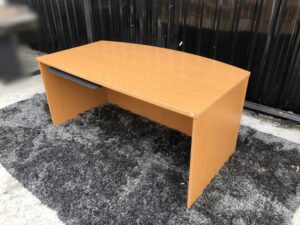 Executive desk With keyboard rail, wooden frame, cream color.