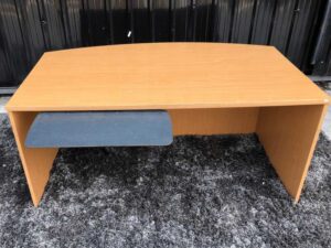 Executive desk With keyboard rail, wooden frame, cream color.