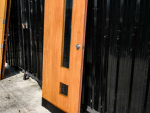 Wooden door with 3 glass panel mullions There is a shock absorber to slow down opening and closing, Soft Close system.