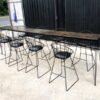 Tall bar table and chairs, black steel frame, wooden top.