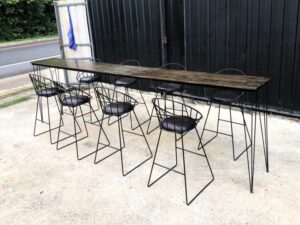 Tall bar table and chairs, black steel frame, wooden top.