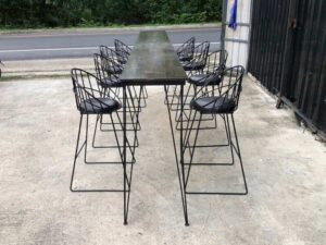 Tall bar table and chairs, black steel frame, wooden top.