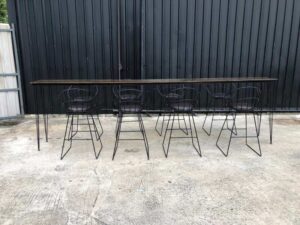 Tall bar table and chairs, black steel frame, wooden top.