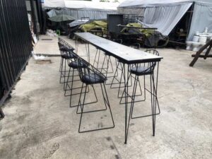Tall bar table and chairs, black steel frame, wooden top.